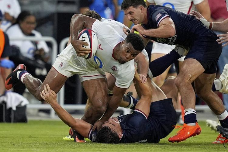 England dominates US in lightning-delayed rugby match