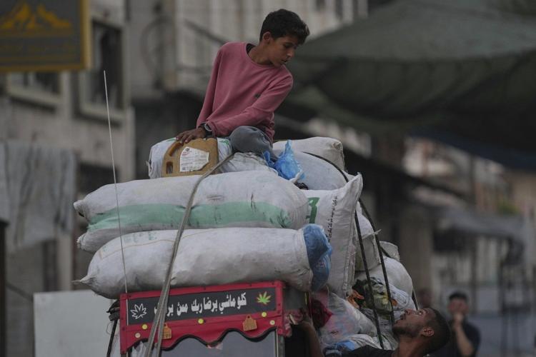 Photos show displaced Palestinians fleeing the northern Gaza Strip