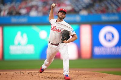 Phillies pitcher Aaron Nola throw to batters, ramping up return from ankle and rib injuries