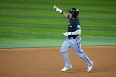 Marlins beat Rangers 6-4 in 12 innings for fourth straight win