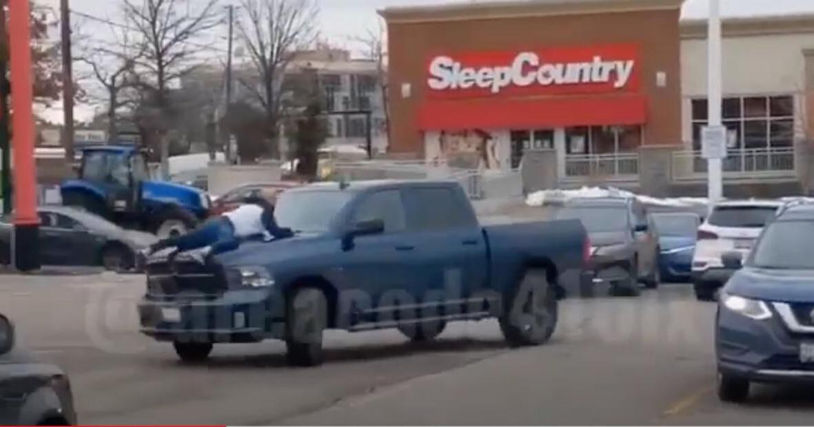 ‘Call the police!’ Video shows man clinging to hood of truck after ...