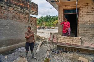 A month after Nepal floods, thousands are still missing and families face a long recovery