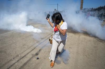 Photos of a confrontation between protesters and federal officials outside California farm