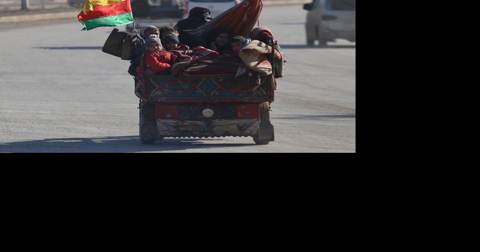 UN aid convoy delivers supplies to besieged city in northeast Syria as a shaky ceasefire holds