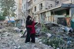 Russian attack on Ukraine kills at least 11 and traps others in damaged buildings