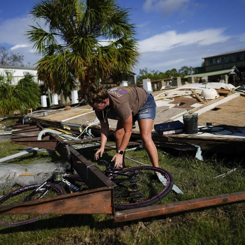 Residents pick through the rubble of lost homes and scattered belongings in  Hurricane Idalia's wake