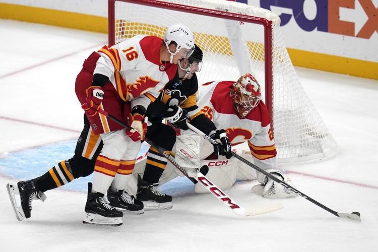 Malkin, Penguins surge past Flames with 5 goals in the third period for a  5-2 win