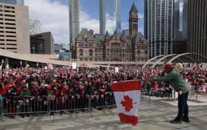 Elbows were up at Nathan Phillips Square as hundreds turn out in solidarity against Donald Trump