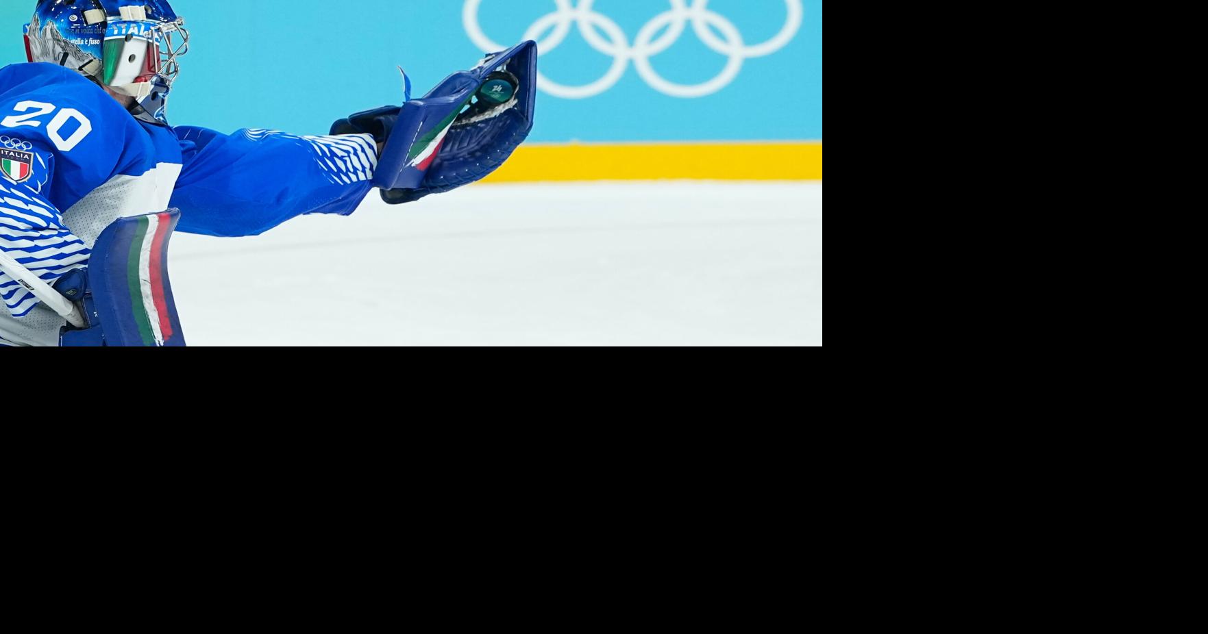 Lighter-colored boards replace dark ones in the hockey arenas at the Olympics