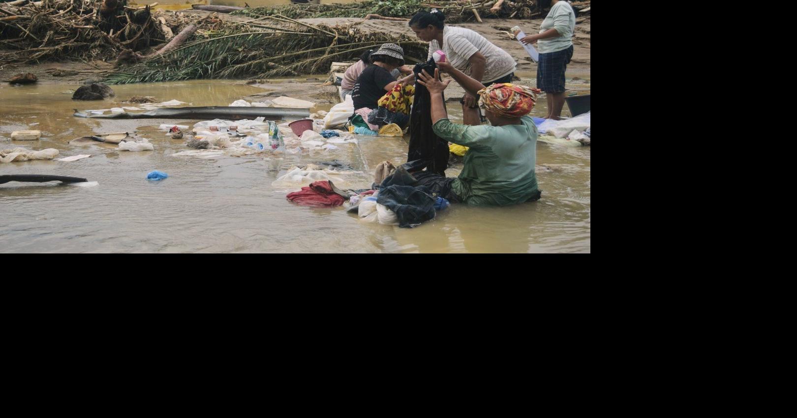 Sumatra residents loot for food and water after deadly floods