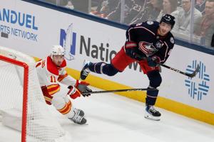 Jenner's goal lifts Blue Jackets to 5-3 win over Flames in Bowness' debut as coach