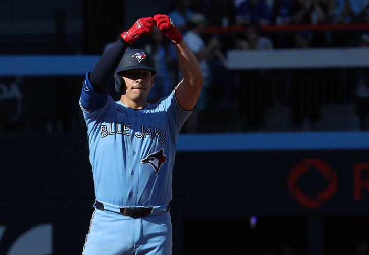 Why do the Blue Jays tap their knuckles when they get on base?