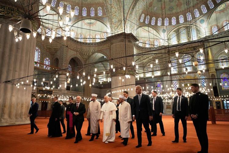 Pope visits Istanbul's Blue Mosque for meeting with Turkish religious leaders.