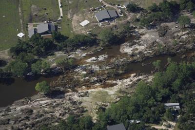 Searchers in helicopters and on horseback scour Texas flood debris for the missing