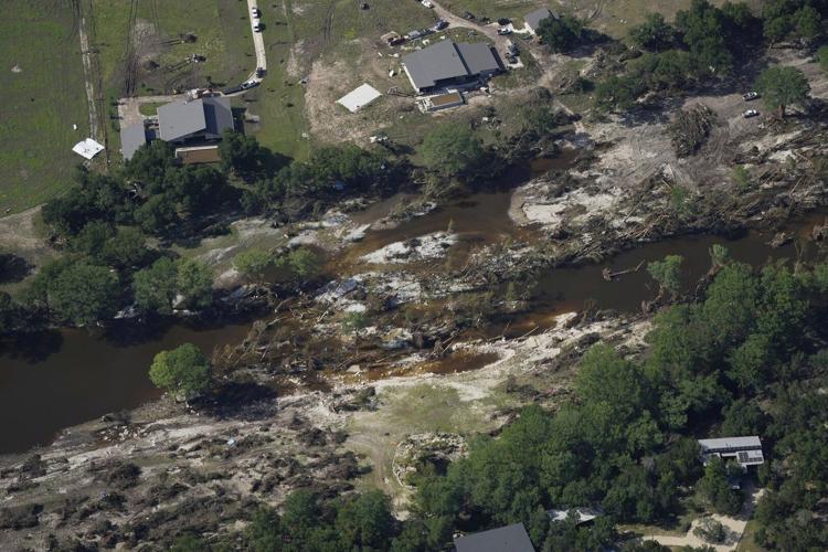 Searchers in helicopters and on horseback scour Texas flood debris for the missing