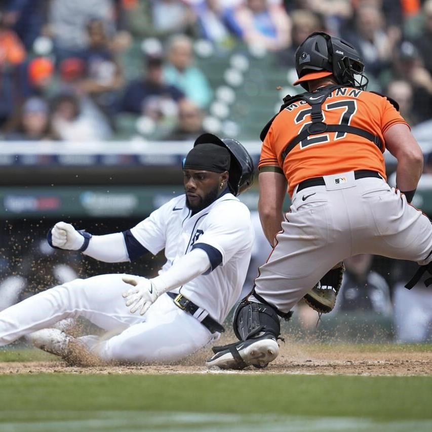 Rodriguez gets 1st MLB win, Orioles split DH with Tigers