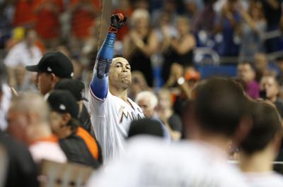 Giancarlo Stanton homers twice to reach 59, Marlins top Braves