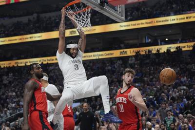 Anthony Davis leads Mavericks past Rockets 116-105 in Mavs debut but leaves  with lower-body injury