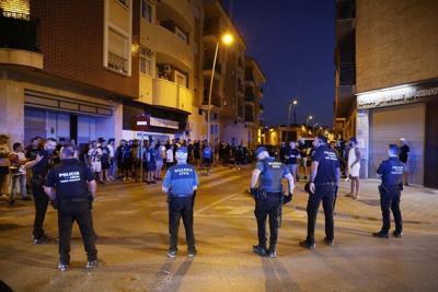 Police detain 8 people after anti-migrant clashes in Spanish town