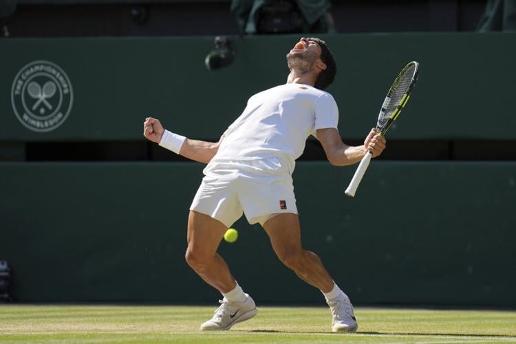 Two-time defending champion Carlos Alcaraz beats Taylor Fritz to return to the Wimbledon final