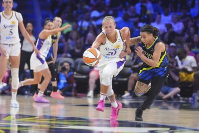 Allemand scores 21, Burrell sparks late run; Sparks beat Wings 91-77, remain alive in playoff hunt