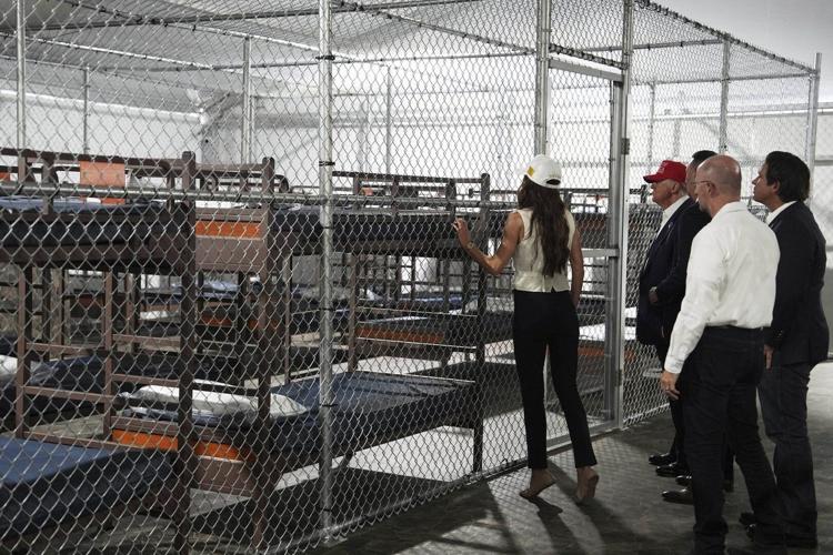 Photos of Trump touring an immigration detention center dubbed ...