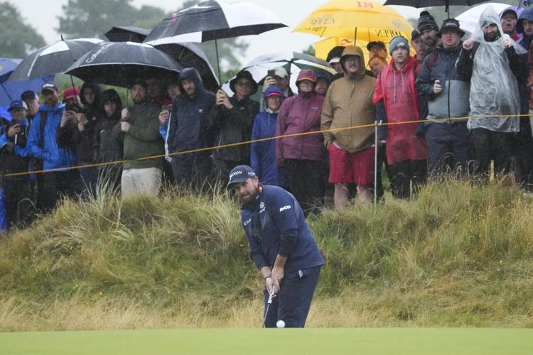 Horschel leads British Open on wild day of rain and big numbers at