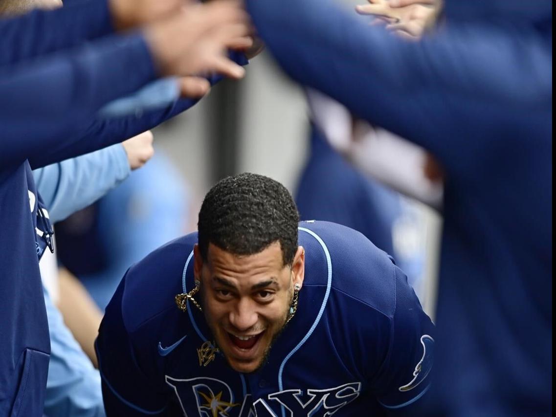 Cleveland Guardians' Amed Rosario (1) and Steven Kwan, right, celebrate  after defeating the Tampa Bay Rays in a wild card baseball playoff game,  Friday, Oct. 7, 2022, in Cleveland. (AP Photo/David Dermer