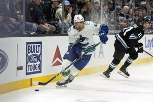 Guenther's third-period power-play goal lifts Utah past the Canucks 2-1