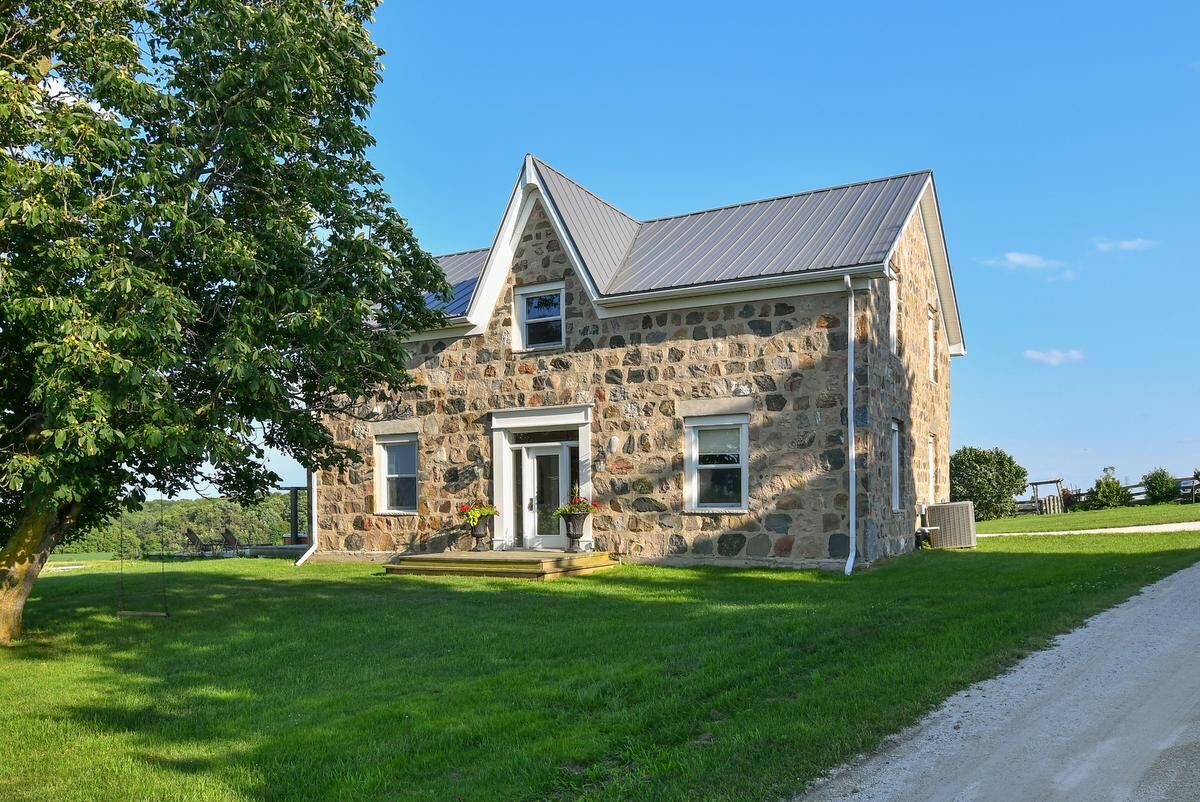 This 3.595 million heritage stone house sits on 82 acres with