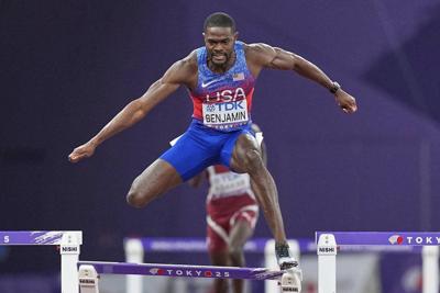 Benjamin wins 400 hurdles, is disqualified, then given worlds gold medal