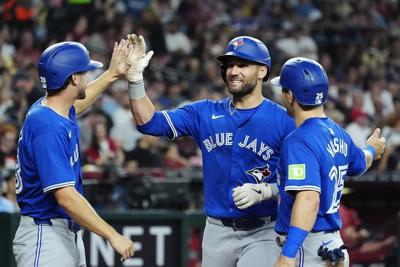 Blue Jays blow 7-run lead, but recover to beat Diamondbacks 8-7 after Guerrero's solo homer