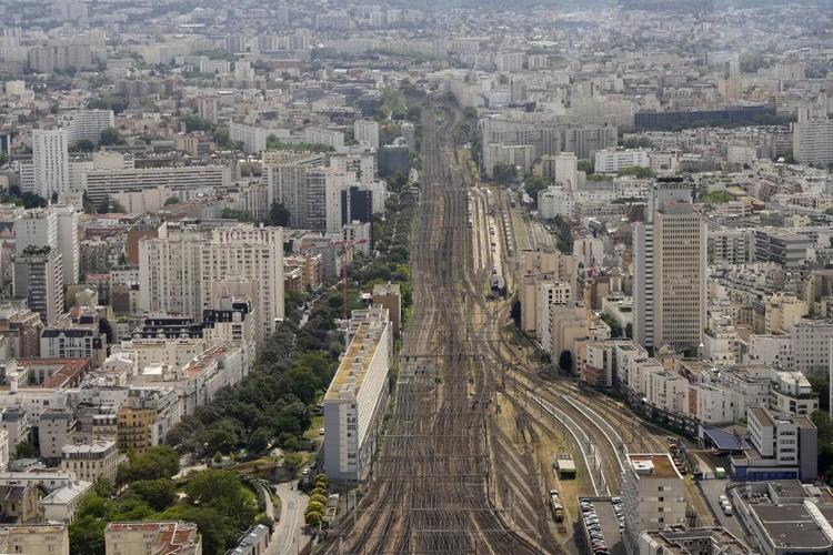 Paris Olympics begins with ambitious but rainy opening ceremony on the