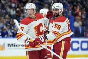 Sharangovich has 2 goals and 2 assists, Markstrom makes 19 saves and Flames beat Lightning 6-3