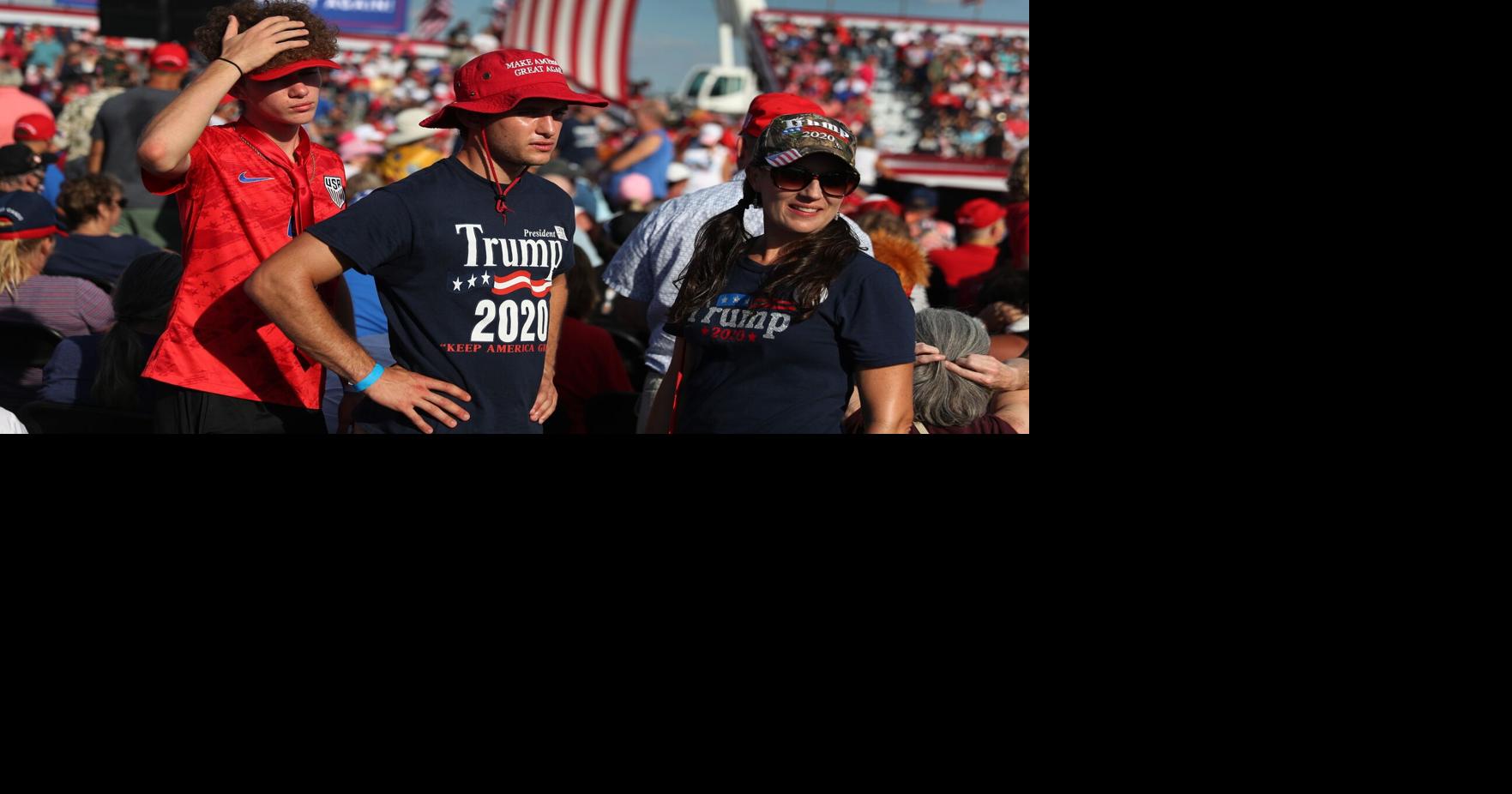 Defiant Trump defends virus record in 1st post-COVID rally