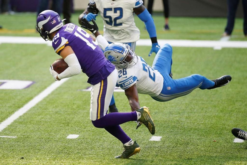 Cook runs over Lions, Vikings rough up Stafford in 34-20 win