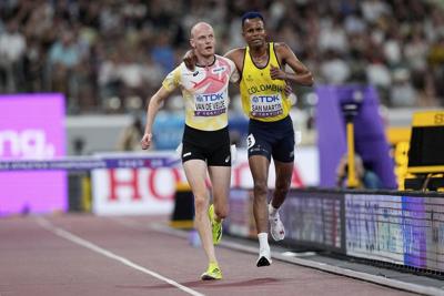 A shoulder to lean on: Steeplechaser stops, lends a helping hand to a struggling competitor