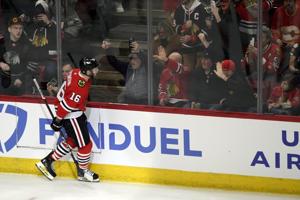 Dickinson scores twice, last-place Blackhawks smother Flames 3-1