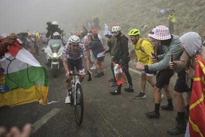 Ineos-Grenadiers team car hits spectator during Tour de France