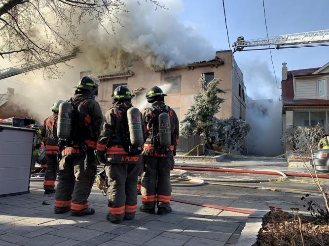 Four-alarm fire sends four to hospital, one in critical condition