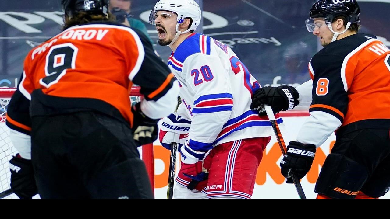 Philadelphia Flyers' Claude Giroux battles with New York Rangers