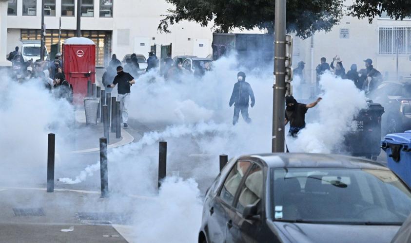 Protesters block roads and start fires across France to challenge the new prime minister, in photos