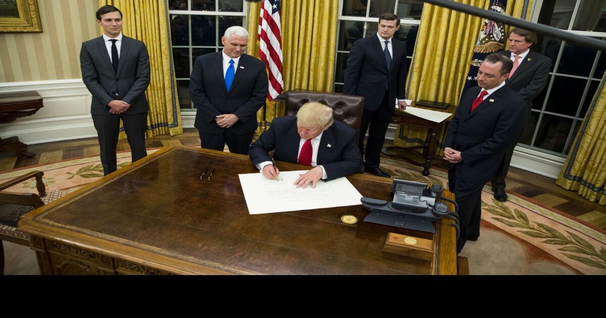 President Trump rolls out golden rug, curtain in redecorated Oval Office
