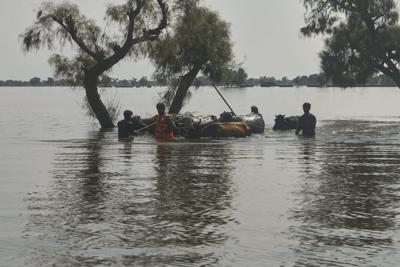 Rescuers in Pakistan scramble to save residents as swollen rivers reach dangerous levels