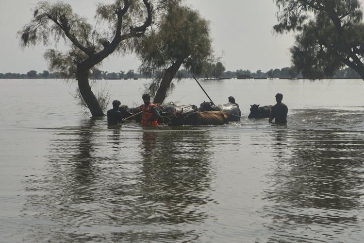 Rescuers in Pakistan scramble to save residents as swollen rivers reach dangerous levels