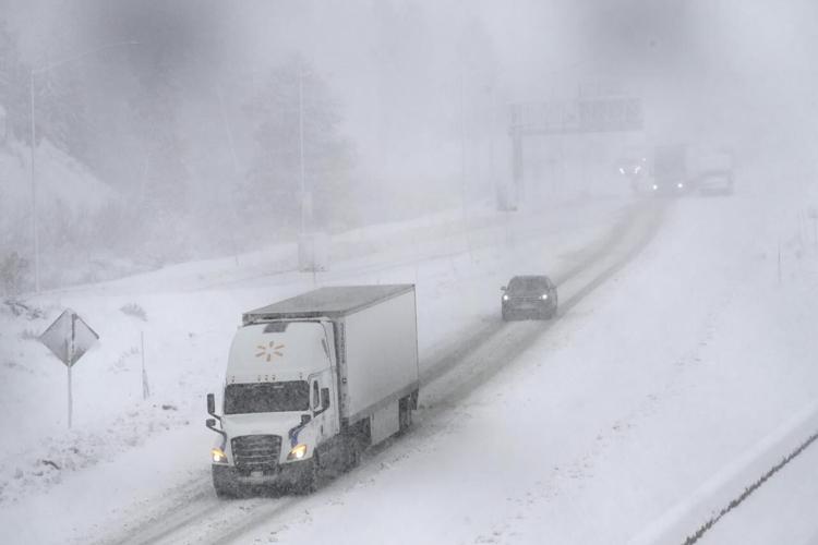 A massive blizzard howls in the Sierra Nevada. High winds and heavy ...