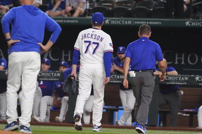Rangers closer Luke Jackson takes comebacker off pitching hand on only his pitch against Rockies