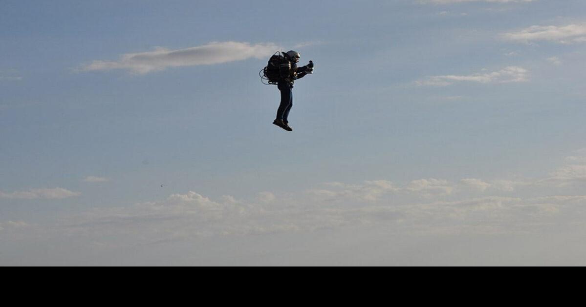 Man wearing jet pack buzzes around Statue of Liberty