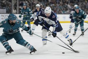 Eklund scores tiebreaking goal late in 3rd period to send Sharks past Jets 2-1