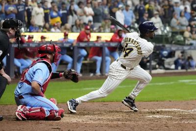 Playoff-bound Brewers rally from 5 runs down to beat Cardinals 9-8 in 10 innings